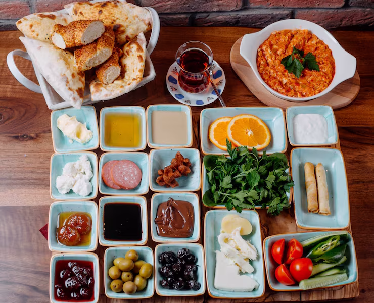 top-view-breakfast-with-fried-eggs-honey-jams-fresh-vegetables-cheese-wooden-table_140725-10358